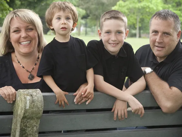 The Martz family: Arlene, Ryan, Devon and Cliff on a park bench